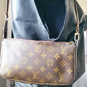 Louis Vuitton Monogram Pochette accessories bag with leather strap.